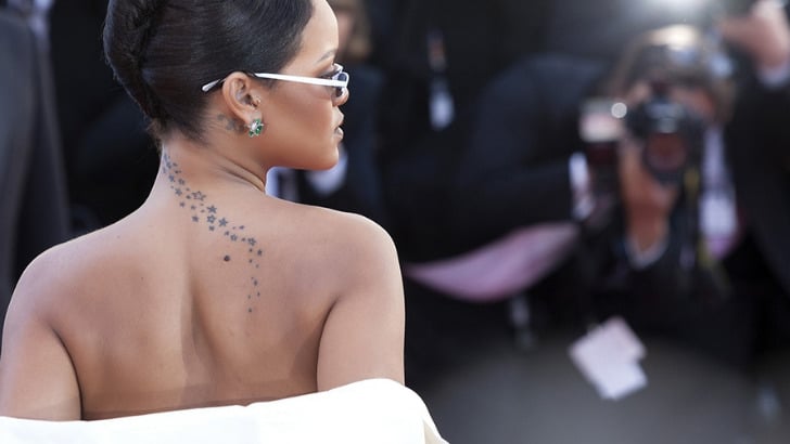 View from behind of Rihanna on the red carpet.