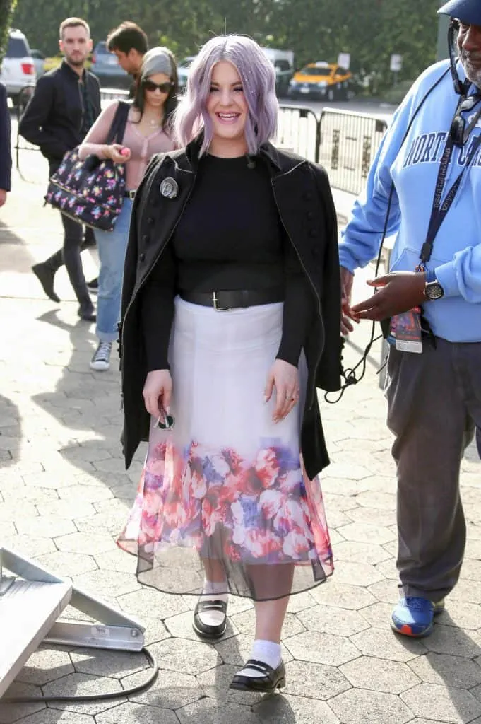 kelly osbourne style - wearing floral skirt and leather jacket