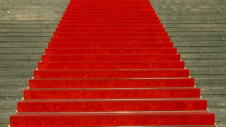 Red carpet running up stairs outside.