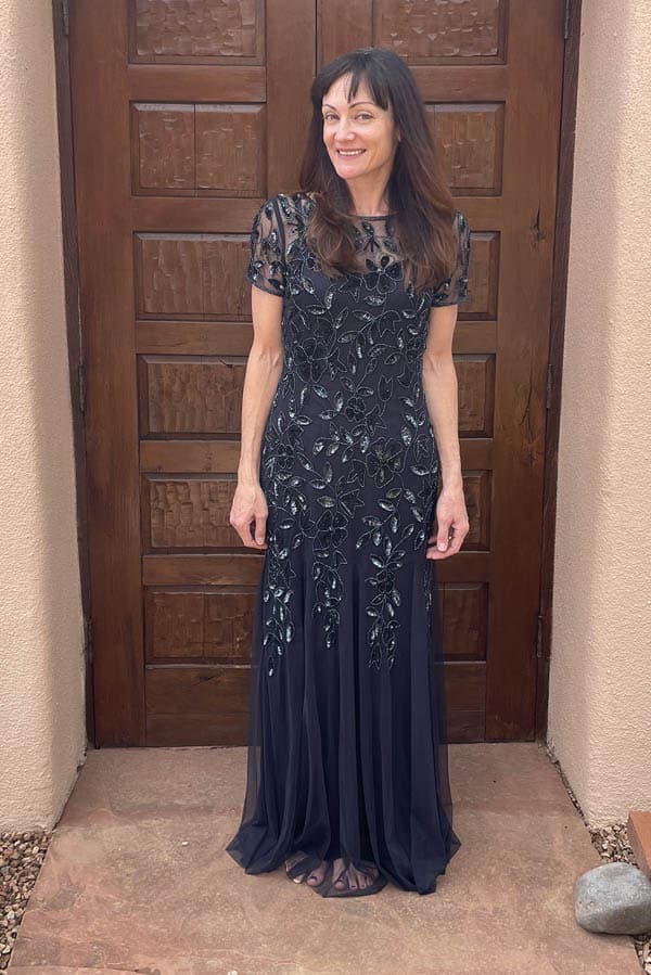 Anna Brock wearing beaded navy formal gown, available on Amazon.