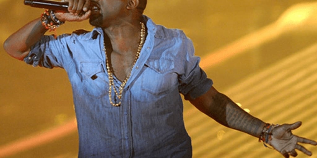 Kanye WEst wearing a denim ombre shirt