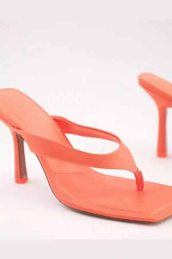 Orange neon heeled sandal.