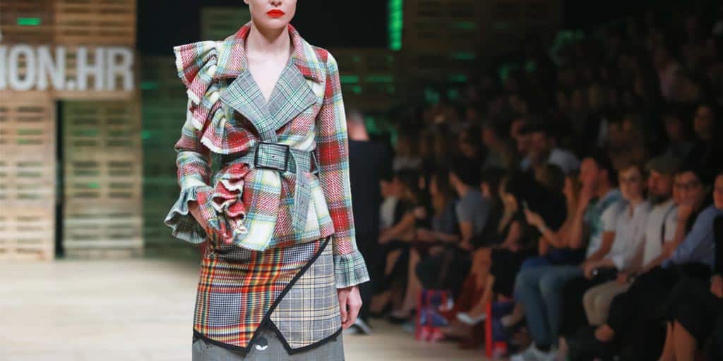 Runway model wearing patterned outfit