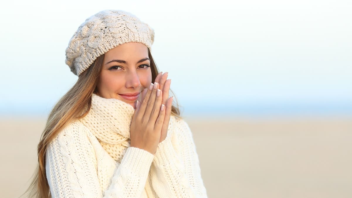 woman wearing beanie and scarf in winter