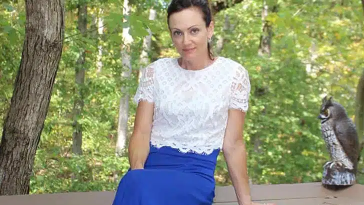 Anna Brock shows how to winterize summer clothes by wearing a crop top over a maxi dress.